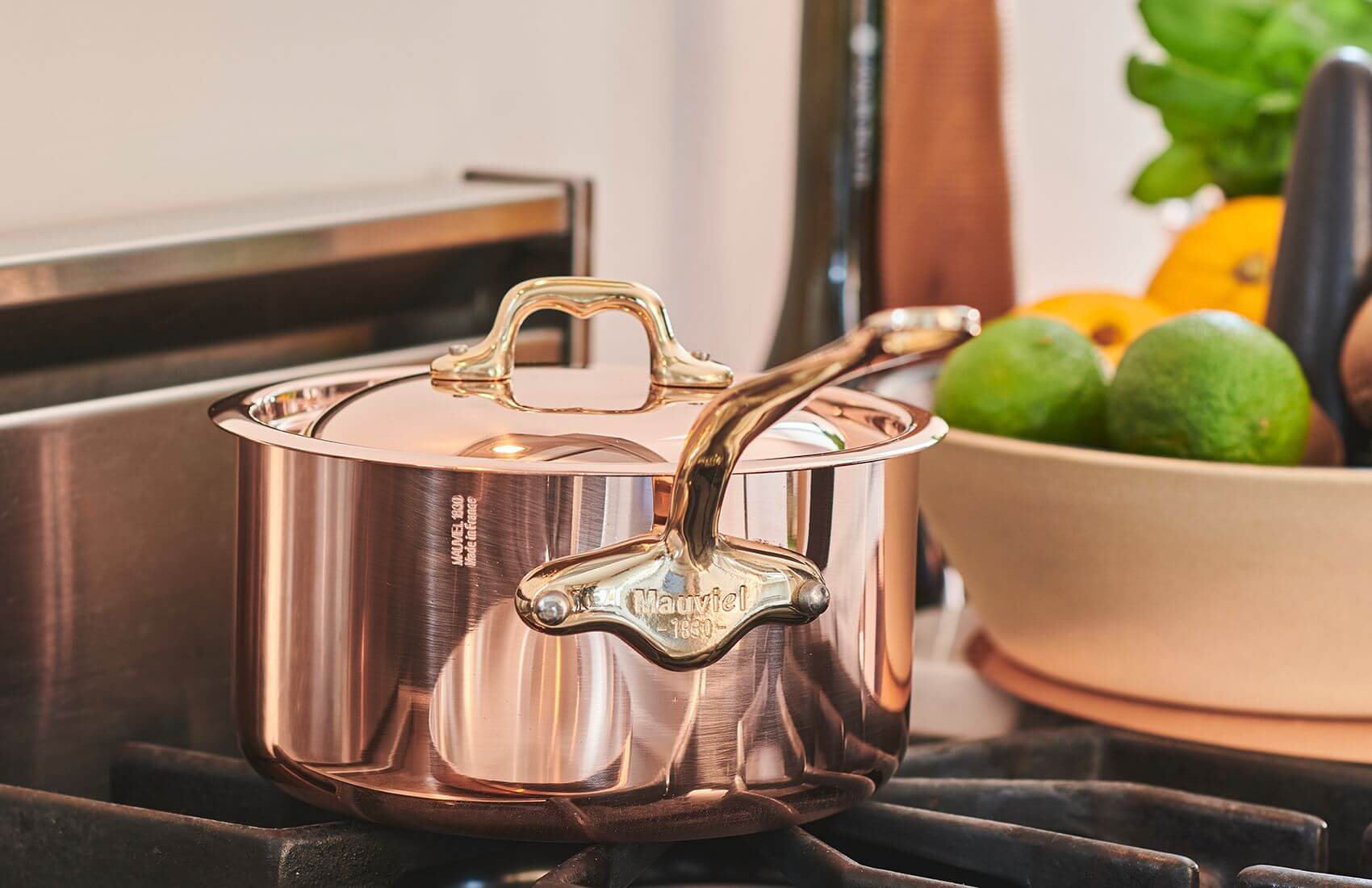 Mauviel copper saucepan over a gas flame